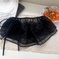Detail of black polka dot mesh skirt showing the side-tie design and sheer texture - Lace-up X-Point Black / Black