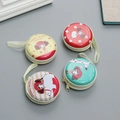 Set of four round tinplate coin purses featuring cartoon animal prints and lanyards - Style D Mixed - Animal Illustrations