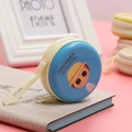 Detail of round tin coin purse with cute cartoon boy print and yellow zipper closure - Little Amélie Glasses Girl Blue Style 05