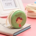 Green round tinplate coin purse featuring a cartoon girl and a convenient zipper strap - Little Amélie Cartoon Girl Green Style 01