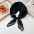 Elegant semi-transparent black silk scarf styled on a linen shirt with wooden props - Black with Contrast Border