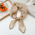 Champagne sheer square silk scarf tied in a neck knot on a grey linen shirt - Khaki with Contrast Border