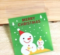 Green Christmas snowman and tree pattern self-adhesive cookie bag on wood surface - 10*10+3 Double Snowmen