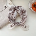 White cotton linen scarf with vintage brown floral pattern tied on a beige top - 08 Heart Star Leaf Beige