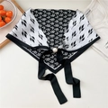 Detail of black and white leaf print satin scarf with large pearl and bow tie - Pearl Buckle - Three-leaf Black White