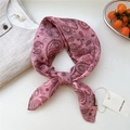 Pink paisley vintage bandana in cotton linen, styled as a bow on a white background - Heart Paisley Pink