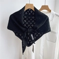 Detail of black geometric hollow knit shawl showing delicate crochet texture on white shirt - Hollow Four-leaf Black