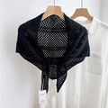 Close-up of black hollow-out knitted triangular shawl with intricate crochet mesh detail - 82x82x142cm / Black
