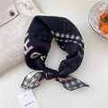 Black square scarf with check pattern and red heart print in a stylish tied knot - Black Woven Grid Border