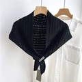 Detailed view of black crochet knit shawl with intricate cut-out patterns on white shirt - 70x120cm / Black