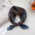 Brown cashew paisley cotton-linen blend scarf in a stylish blue knotted display - Brown Bead Floral