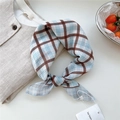 Blue and brown checkered cotton linen scarf with tag on neutral fabric background - Dot Stripe Woven Check Brown