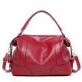 Red pebbled leather Boston handbag with dual top handles and adjustable shoulder strap - Burgundy