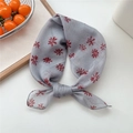 Grey cotton linen scarf with red daisy print, knotted on white surface - 10 Grey Brush Floral