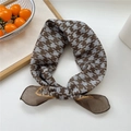 Brown houndstooth silk scarf with yellow trim detail on a minimalist white surface - 07 Houndstooth Brown
