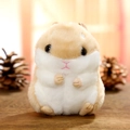 Cute beige plush hamster keychain accessory on wood surface with pinecones - Brown