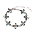Silver flower bracelet featuring rainbow abalone shell inserts and adjustable lobster clasp - Flower