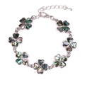 Silver bracelet featuring seven colorful abalone shell four-leaf clover charms in a circle - Four-Leaf Clover