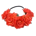 Close-up of vibrant red artificial roses and green leaves on a black floral headband - Orange Red