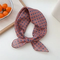 Dusty rose floral scarf with daisy print tied in a knot on a clean white surface - 14 Floral Dots Rose Pink
