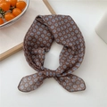 Coffee brown floral silk scarf with blue and white flowers in a knotted style - 16 Floral Dots Brown