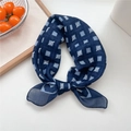 Dark blue checkered linen square scarf tied in a stylish knot on a clean wooden tray - 22 Navy Snake Grid
