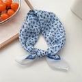 Blue floral print square neck scarf in soft cotton linen displayed on a white table - 25 Rice Blue Frame