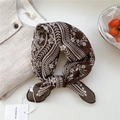 Dark brown floral silk scarf with white flower patterns tied on a beige cotton linen shirt - Floral Small Check Brown
