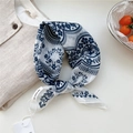Blue and white floral cotton-linen square scarf tied around the neck in a chic knot - Floral Small Check White
