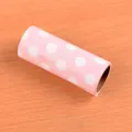 Portable lint roller refill in rose red with white polka dots on wood surface - Refill - White Polka Dot