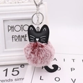 Cute black cat keychain featuring a reddish-brown plush fur ball and silver metal ring - Two-tone Wine Red