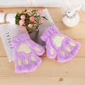 Close-up of purple plush cat paw fingerless gloves with brown velvet pads for winter - Purple