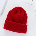 Classic red ribbed knit beanie for winter featuring a stylish cuffed design and warm texture - Wine Red