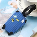 Blue suitcase-shaped silicone luggage tag with travel 3D decals and black buckle strap - Blue