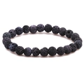 Macro detail of 8mm black volcanic lava stone beads showing natural porous texture - Gray