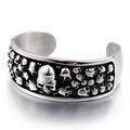 Retro punk titanium steel open cuff bracelet with embossed skull heads in silver finish - Silver