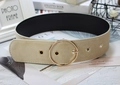 Detail of beige suede wide waist belt featuring a gold round buckle and metallic eyelets - Round Buckle Apricot