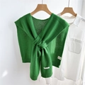 Detail of green knitted wool shawl showing cross-knot style on a white shirt - Dark Green