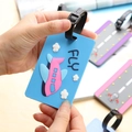 Sky blue PVC luggage tag featuring a 3D pink airplane and clouds with a black strap - Blue With Pink Airplane
