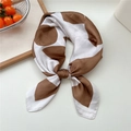 Brown and white silk-textured square scarf with geometric dots tied in a decorative knot - Camel Circular Geometric