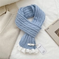Macro detail of light blue cable knit scarf featuring white lace edges and brand tags - 9*155cm / Blue