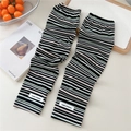 Detailed view of the striped ribbed knit texture and soft fabric of the cooling arm sleeves - One Size / Color Stripe Black