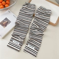 Detail of striped knitted cooling arm sleeves with ribbed texture and woven brand label - One Size / Beige Striped
