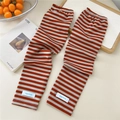 Close-up of striped cooling arm sleeves with orange and grey bands and a logo label - One Size / Two-tone Orange