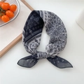 Classic paisley print square scarf in black and white tied in a decorative ring knot - Cotton Sun Paisley Black