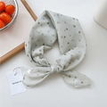 Green polka dot cotton linen neck scarf tied in a bow with product tags on white background - Gradient Polka Dot Green