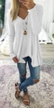 Detail of white waffle knit V-neck sweater showing its loose draped silhouette and textured fabric - White