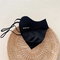 Detail of black breathable sun protection mask with BOWLOW logo and adjustable ear loops - One Size / Black