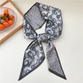 Long paisley print satin scarf in grey and blue tied in a decorative knot - Colorful Paisley Grey Edge