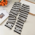 Close-up of striped cooling arm sleeves with ribbed texture and HELLO ACHV fabric tag - One Size(10x50cm) / Black White and Brown Stripes
